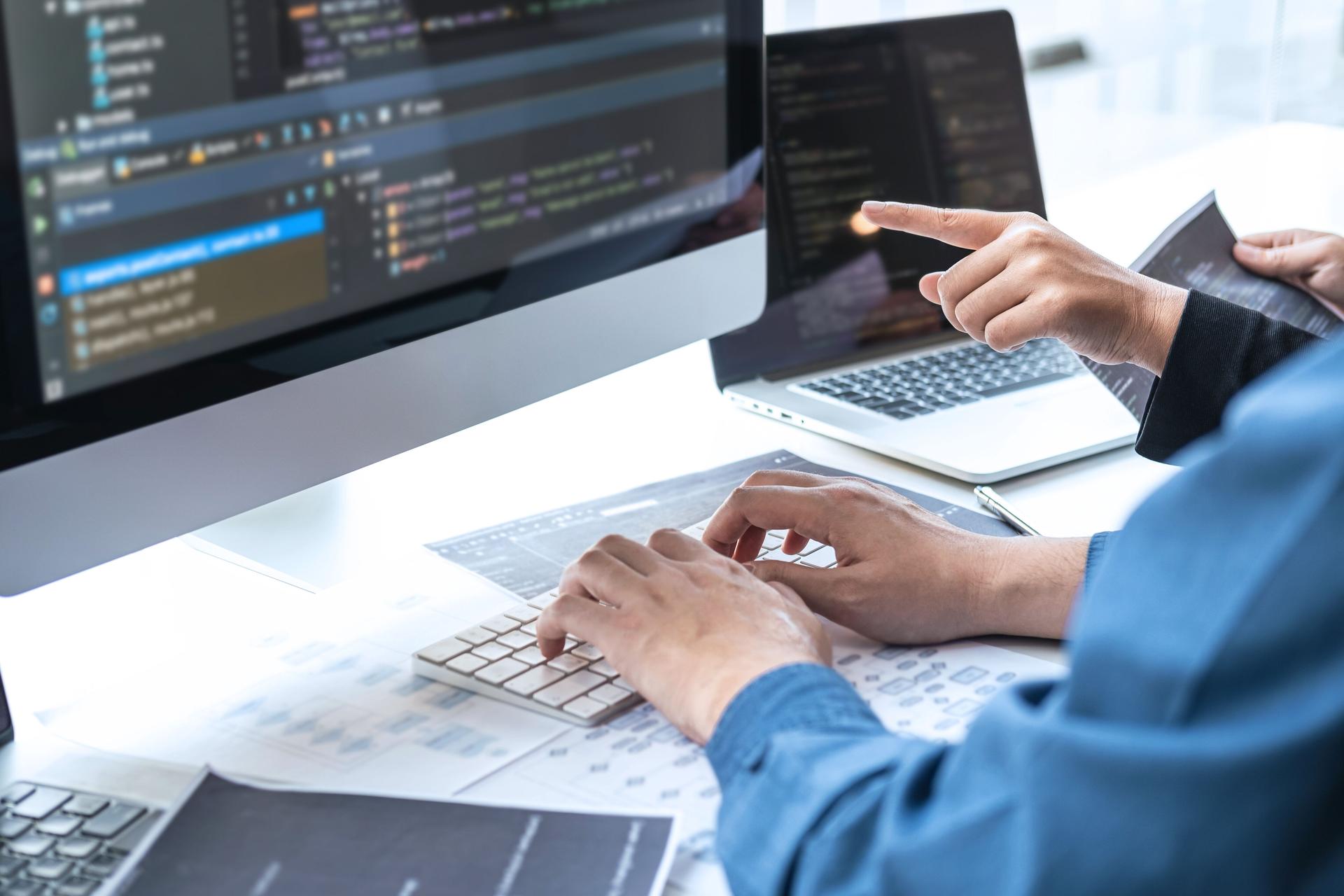 Team of Professional Developer programmer cooperation meeting and brainstorming and programming in website working a software and coding technology, writing codes and database